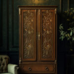 Moody view of an Art Nouveau wardrobe with carved wooden panels,